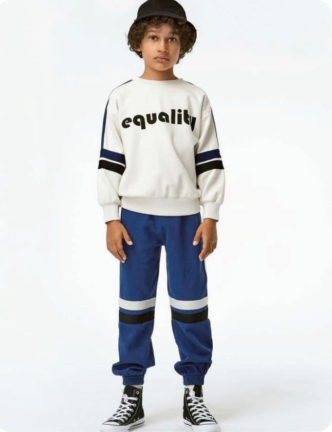 Kidswear production — teal tracksuit sets from our factory network
